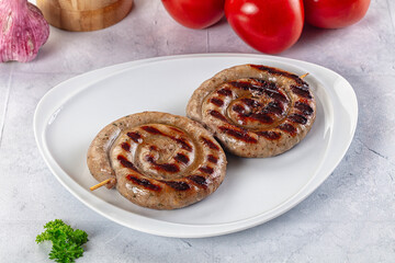 Grilled beef round circle sausages