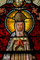 Stained glass (19th century) of Virgin Mary at prayer.