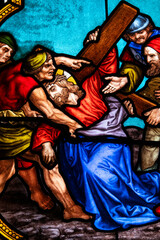 Obraz premium Hasparren, France - 04-22-2025: Stained glass (19th century) of The Way of the Cross. Seventh station: Jesus falls for the second time. ..