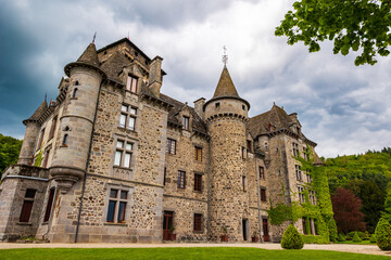 Fototapeta premium Facade of the Pesteils Castle in Polminhac in the Cantal