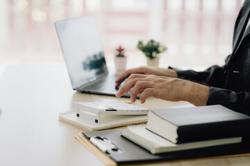 Business Professional Working on Laptop at Desk