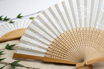 Korean traditional white buchae fan displayed on clean wooden surface elegant folds