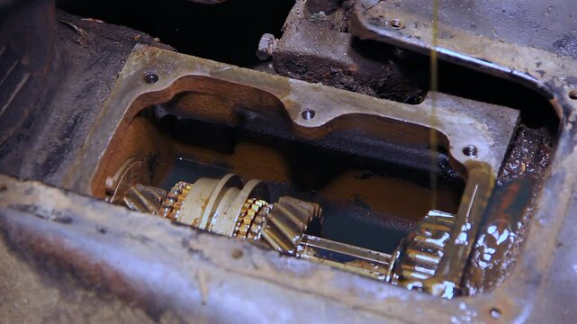 Oil Being Poured Into An Open Vehicle Manual Transmission