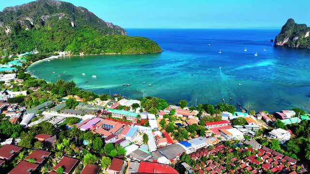 Aerial Panning Beautiful Shot Of Resorts On Phi Phi Island By Maya Bay During Sunny Day - Phi Phi Islands, Thailand