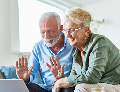 woman couple senior man happy internet love laptop call video communication online together mature active elderly retirement computer connection two using