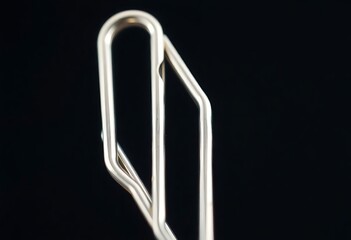 close up of a metal object on a black background