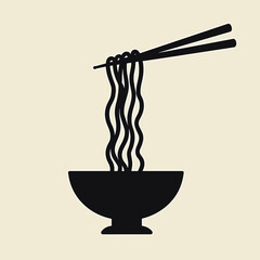 Bowl of noodles with chopsticks against a beige background  