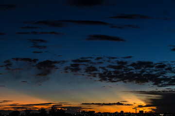 Dramatic sunset in the Sky through cumulus storm clouds,. Awesome epic landscape. Amazing vibrant...