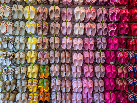 Honolulu, Hawaii, USA - 4.20.2025: Rows of Croc footwear and sandals at Princess Kaiulani