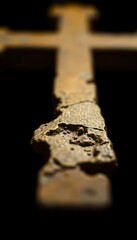 close up of a cross on a black background