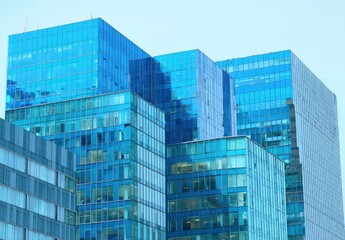 Obraz premium Modern glass skyscrapers reflecting the sky.