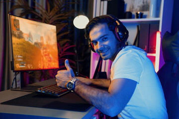 Smart gaming streamer enjoy playing battle team looking camera to pose with streaming online with...