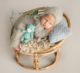 Newborn Baby Sleeping With A Smile In A Studio Photo
