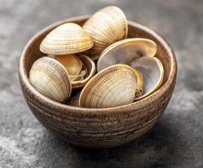 Freshly picked raw clams in a bowl, with space for copy