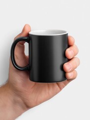 Black Mug in Hand: A Simple, Clean Product Shot
