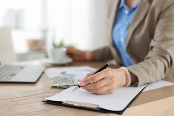 Professional banker working at desk in office, closeup
