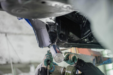 treatment of the car body bottom with anti-corrosion compound
