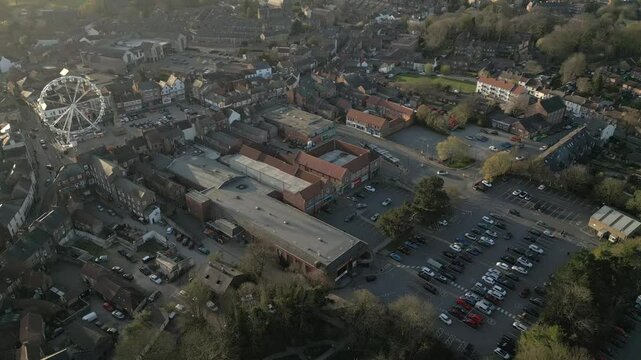 Scenic aerial view of Ripon, Yorkshire with Ferris Wheel and bustling car park captures the charm of this lively town