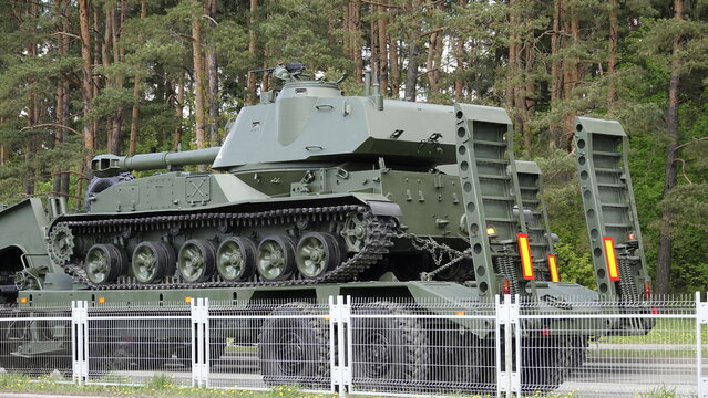 How heavy military equipment on tracks (tanks, artillery, troop carriers and infantry vehicles) are transported by tractor trailer