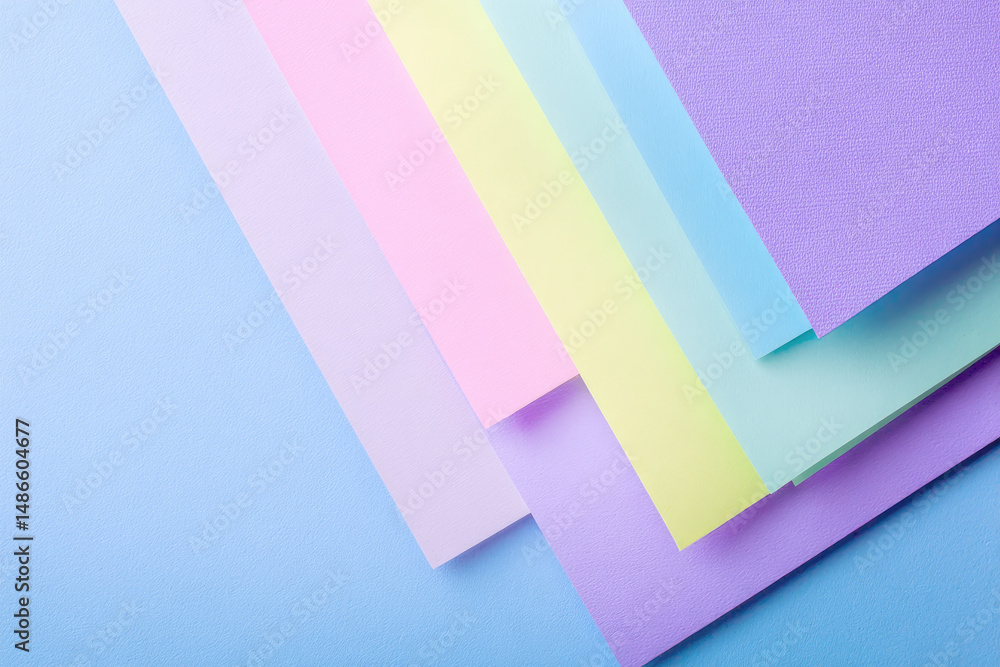 Poster pastel colored paper sheets arranged in fan shape on light blue background create soft and calming v