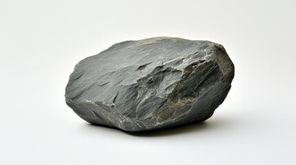 Obraz premium Dark gray rock on white background rough texture isolated object geology nature