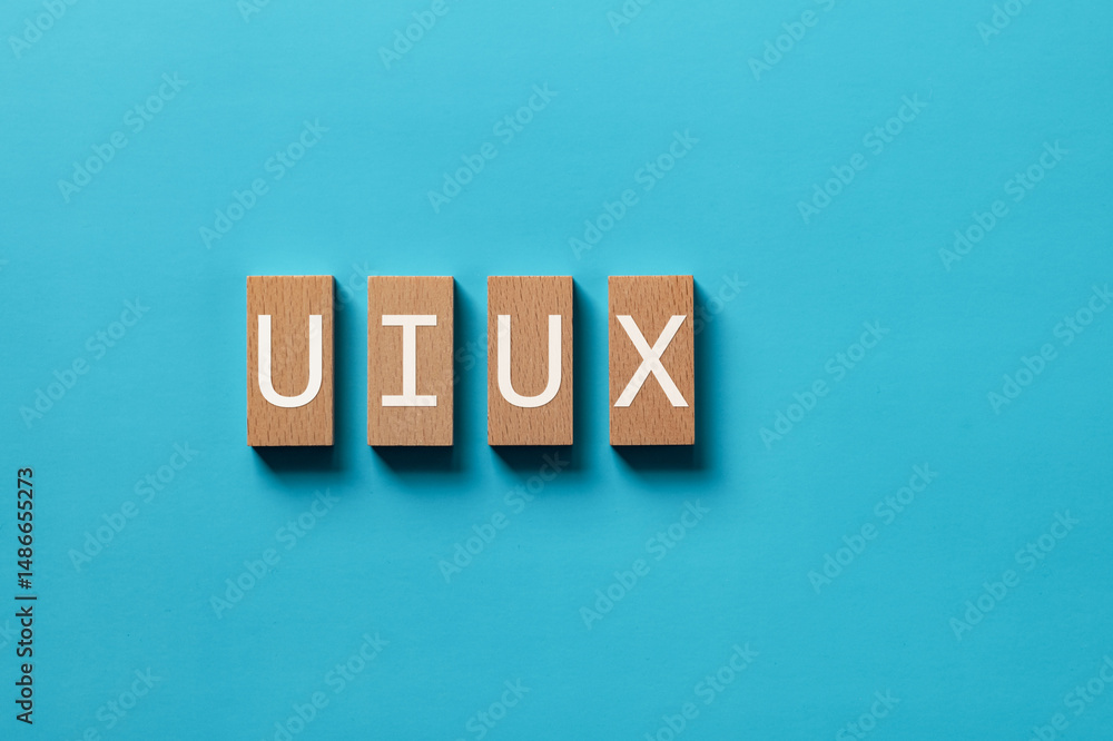 Poster there is wood block with the word uiux. it is as an eye-catching image.