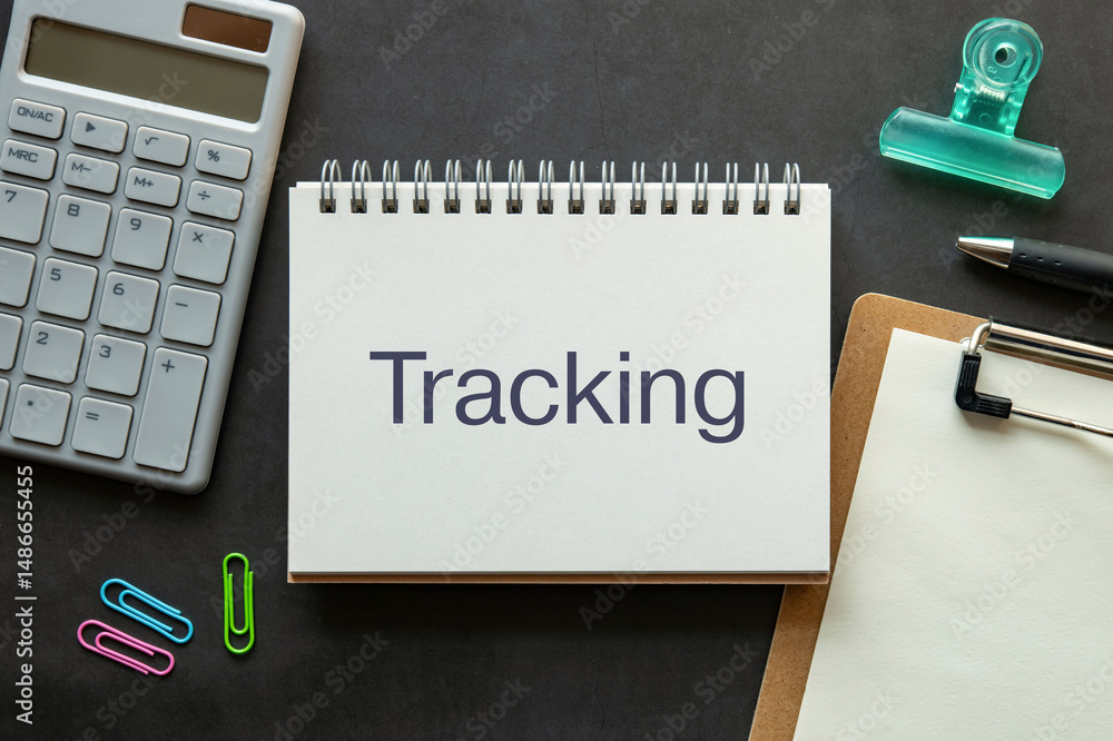 Poster there is notebook with the word tracking. it is as an eye-catching image.