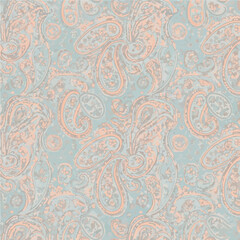 A pastel paisley pattern. Peach and beige paisley shapes are arranged on a light blue textured background, creating a soft, vintage aesthetic.