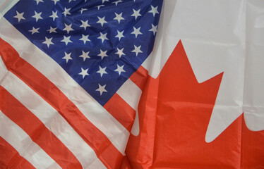 United States and Canada relations concept background with flags of both countries, top view. US...