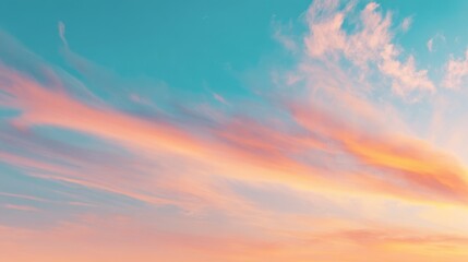 Obraz premium Serene Sunset Sky with Soft Clouds in Shades of Pink and Orange Reflecting the Tranquility of Evening Nature’s Beauty in a Peaceful Atmosphere