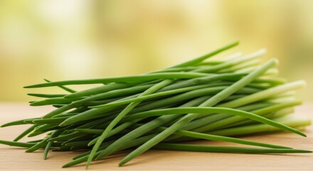 Fototapeta premium Vibrant fresh chives on wooden surface ready for culinary creations