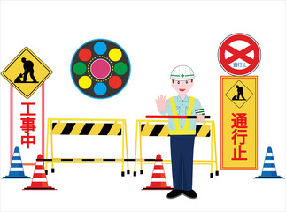 工事現場で交通誘導員が車を誘導している。