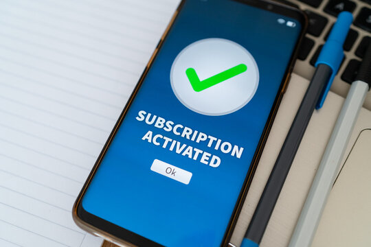 Notification of subscription activated on mobile phone app. Concept of new paid subscription service.