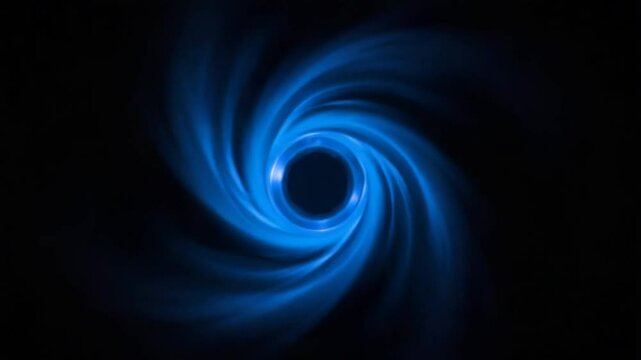 Black background. Motion.The blue rays seem to fluctuate like magic and form the shape of a ball in abstraction.