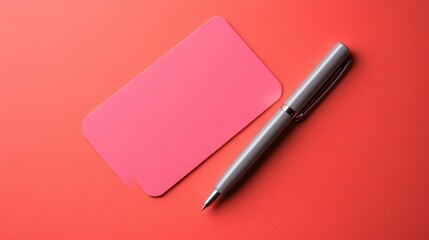 Pink blank card and gray pen on red background flatlay minimalist office stationery mockup