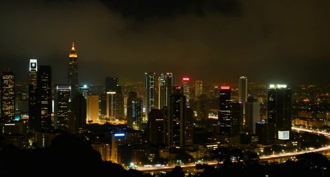 Aerial timelapse of Kuala Lumpur city skyline at night, Malaysia
