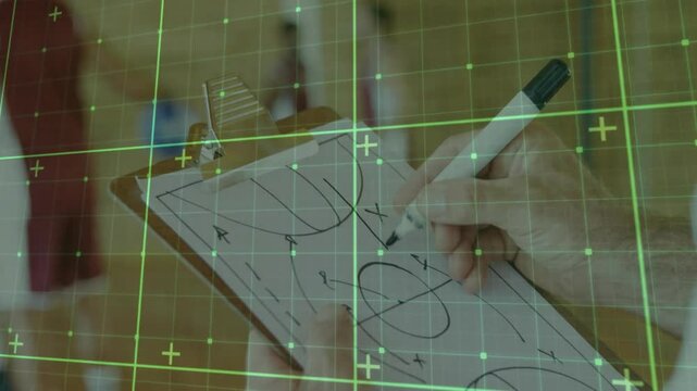 Adult male hand drawing basketball play using marker on wooden clipboard in gym, with grid overlay