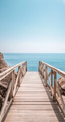 Obraz premium Wooden boardwalk leading to tranquil ocean