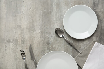 Beautiful table setting on grey background