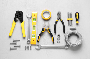 Arrangement of construction tools on white grunge background