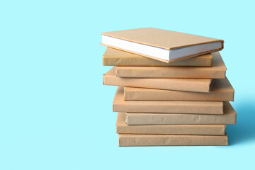 Stack of books on blue background