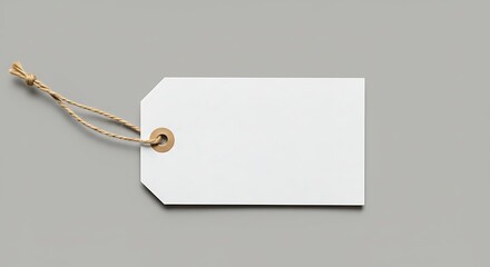 Blank paper price tag with string over neutral background, ideal for customizable sales messages