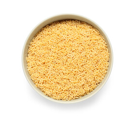 Bowl of raw alphabet pasta on white background