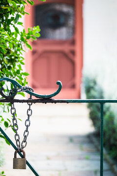 Padlocked gate and home entrance