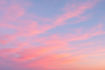 Fototapeta premium Beautiful pink and blue sunset sky with soft cloud patterns