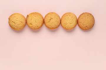 Sweet cookies on pink background