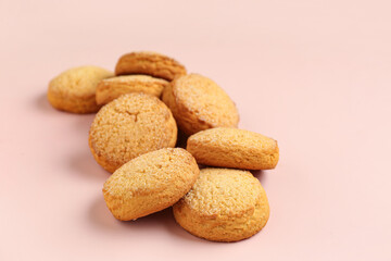 Many sweet cookies on pink background, closeup