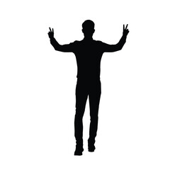 Silhouette of a man standing with both arms raised, showing peace signs with both hands confidently