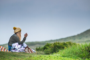 Hip young girl taking pictures with her mobile phone.