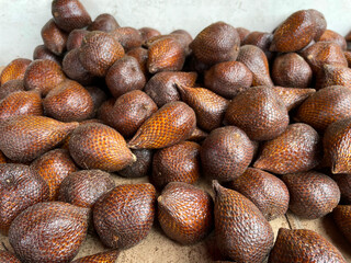 Piles of fresh snake fruit harvested by farmers